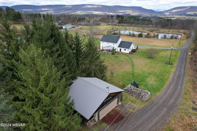 aerial view featuring a water and mountain view