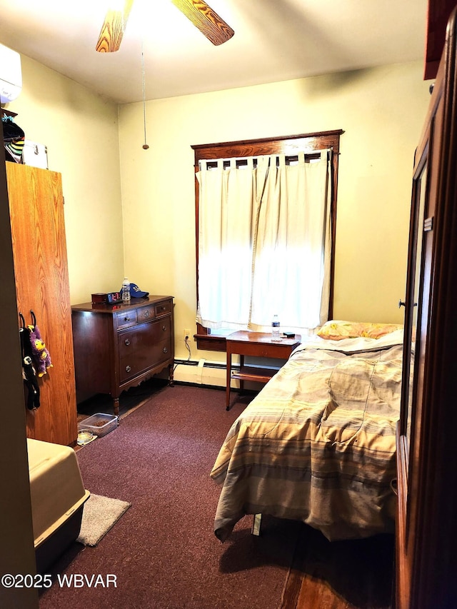bedroom with carpet flooring, a baseboard radiator, and a wall unit AC