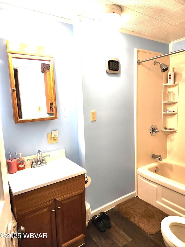 full bath featuring vanity, shower / bathtub combination, toilet, and wood finished floors