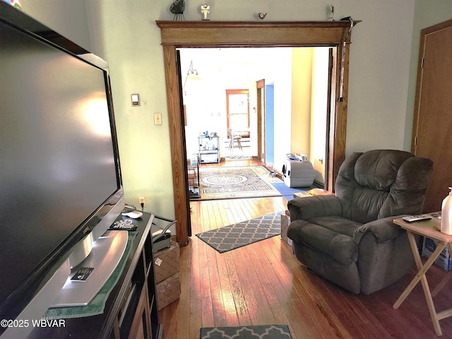 interior space with a wealth of natural light and hardwood / wood-style floors