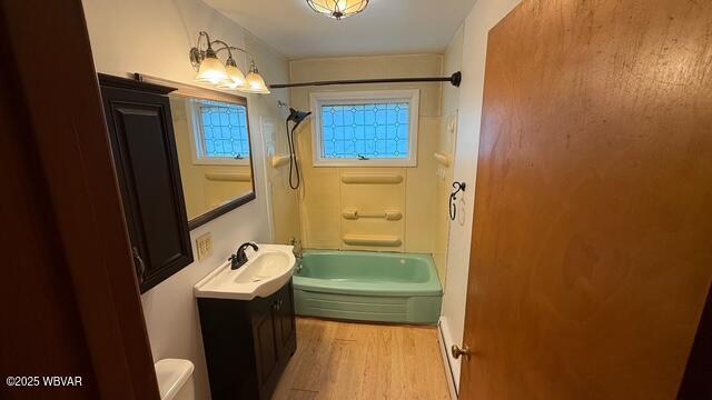 19 Lime Bluff Rd, Hughesville, PA 17737 - bathroom with vanity, wood finished floors, shower / bathtub combination, and toilet