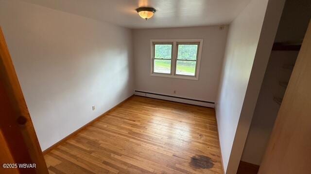 19 Lime Bluff Rd, Hughesville, PA 17737 - spare room featuring baseboard heating and light wood-style floors