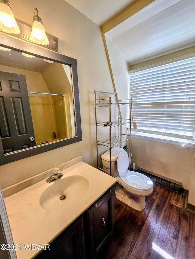 bathroom with a baseboard radiator, hardwood / wood-style floors, an enclosed shower, toilet, and vanity