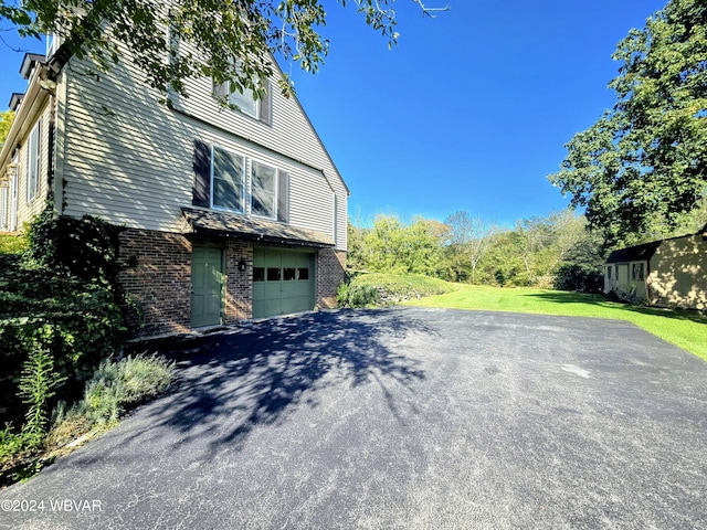 view of side of property featuring a garage