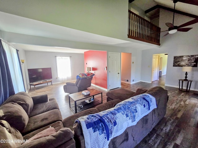 living room featuring hardwood / wood-style flooring, high vaulted ceiling, and ceiling fan