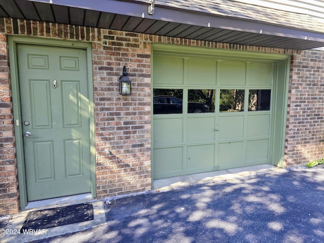 entrance to property featuring a garage