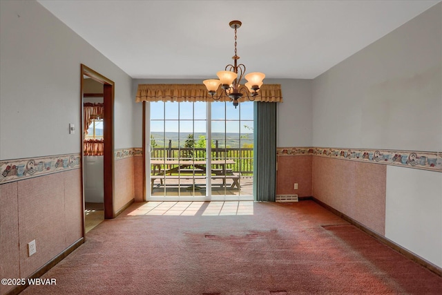 6553 Jacks Hollow Rd, Williamsport, PA 17702 - carpeted empty room with wallpapered walls, a notable chandelier, wainscoting, and visible vents