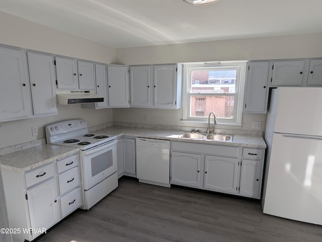 kitchen featuring dark wood-type flooring, white appliances, sink, and white cabinets