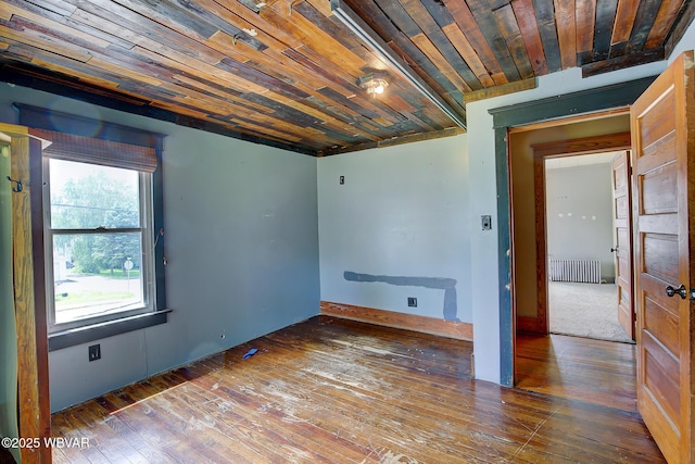320 E Central Ave, Jersey Shore, PA 17740 - spare room featuring radiator heating unit, wood-type flooring, and wood ceiling