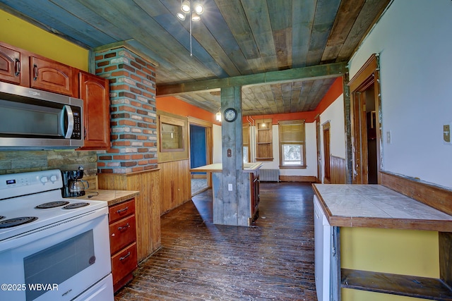 320 E Central Ave, Jersey Shore, PA 17740 - kitchen with electric range, stainless steel microwave, wooden ceiling, dark wood-style flooring, and radiator heating unit