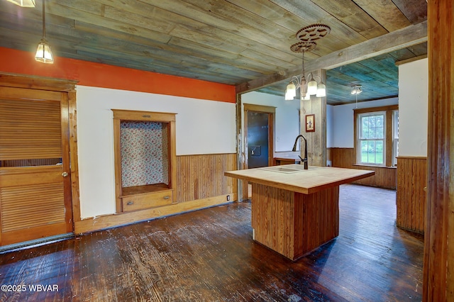 320 E Central Ave, Jersey Shore, PA 17740 - kitchen featuring tile countertops, a wainscoted wall, a sink, wood walls, and wood ceiling
