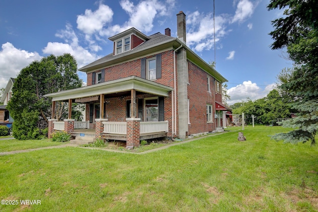 320 E Central Ave, Jersey Shore, PA 17740 - american foursquare style home with brick siding, a porch, a chimney, and a front yard