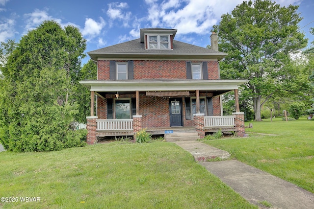 320 E Central Ave, Jersey Shore, PA 17740 - american foursquare style home featuring brick siding, a chimney, covered porch, a front lawn, and a shingled roof