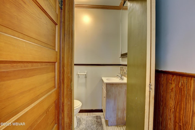320 E Central Ave, Jersey Shore, PA 17740 - half bathroom featuring toilet, vanity, and ornamental molding