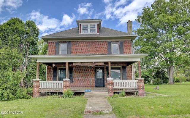 320 E Central Ave, Jersey Shore, PA 17740 - traditional style home featuring a porch, brick siding, a front lawn, and a chimney