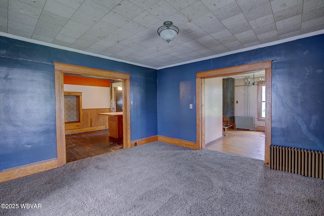 320 E Central Ave, Jersey Shore, PA 17740 - spare room featuring radiator, crown molding, carpet floors, and stairway