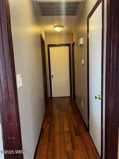 hall with dark hardwood / wood-style floors