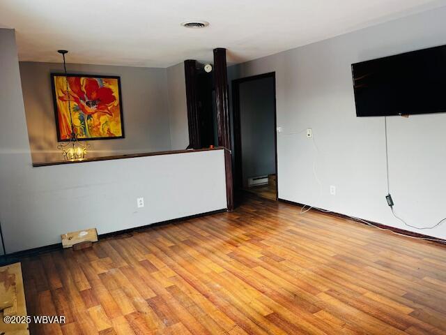 spare room with hardwood / wood-style flooring