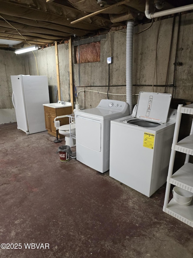 laundry room with washer and dryer and laundry area