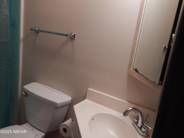 full bathroom with vanity and toilet