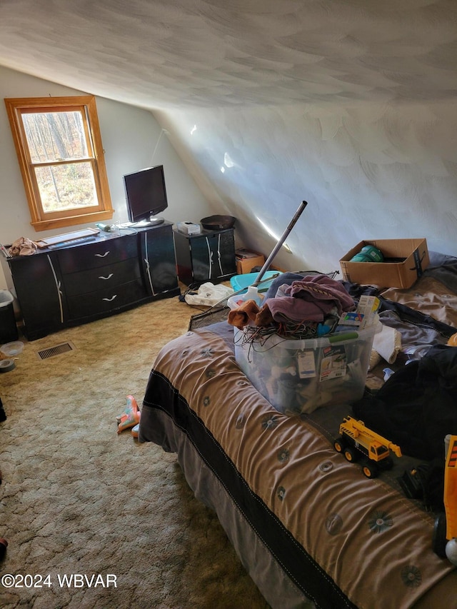 bedroom featuring carpet floors and vaulted ceiling