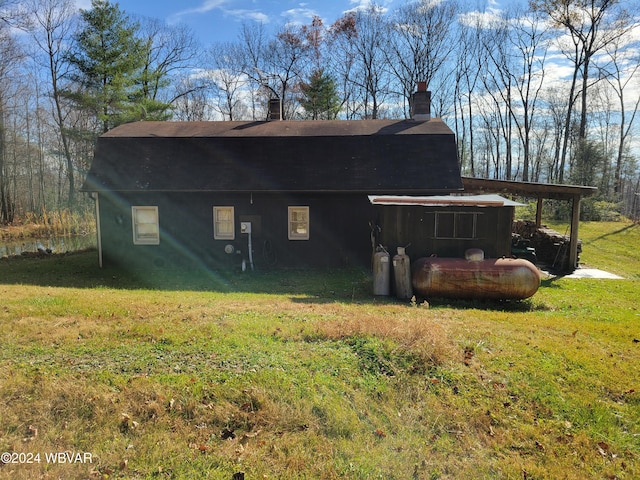 view of home's exterior with a lawn