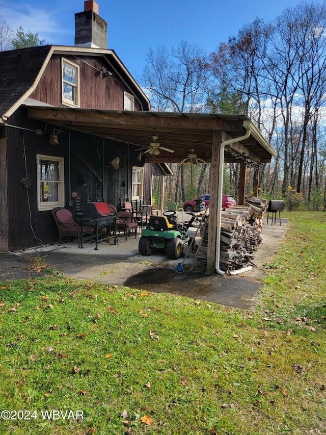 view of patio featuring ceiling fan