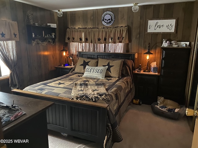 bedroom featuring light carpet and wood walls