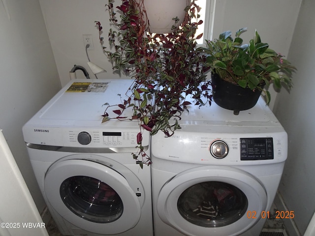 laundry room featuring washing machine and dryer