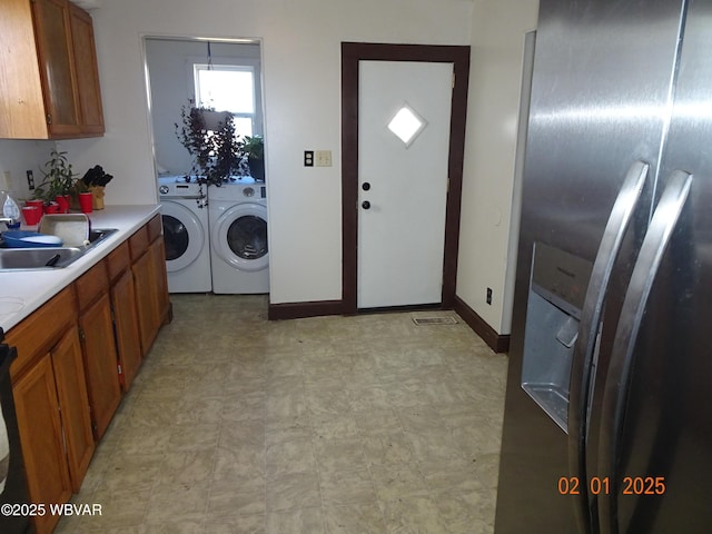 laundry area featuring sink and washer and dryer