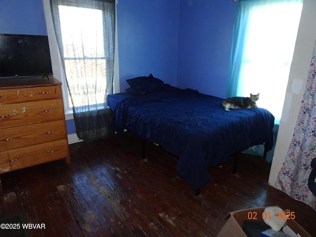 bedroom featuring dark wood-type flooring