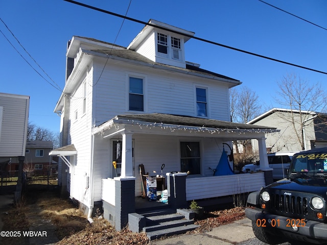 view of front property featuring covered porch