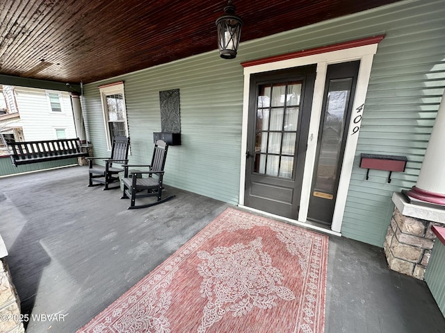 property entrance featuring covered porch