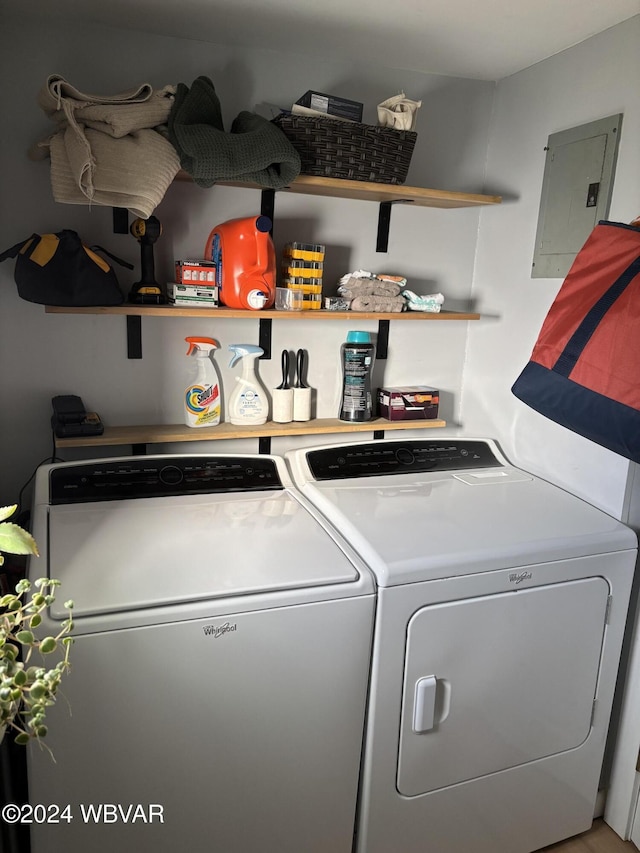 clothes washing area featuring washer and dryer and electric panel