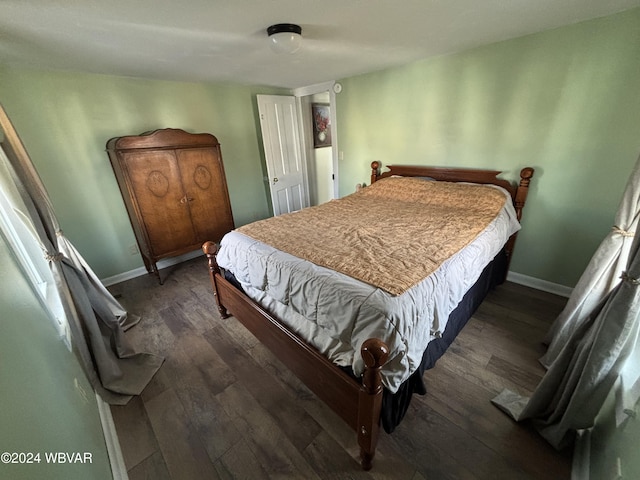 bedroom featuring dark hardwood / wood-style flooring