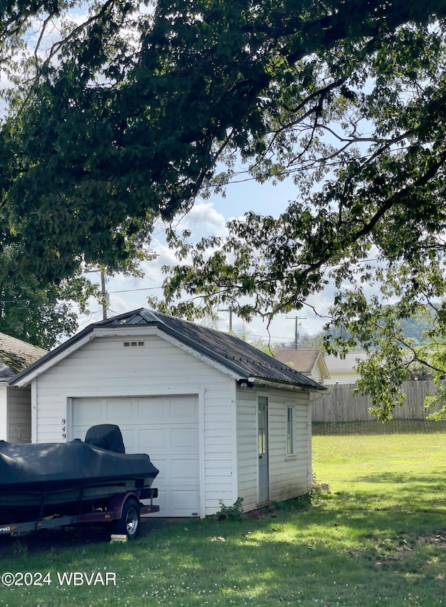 garage featuring a yard