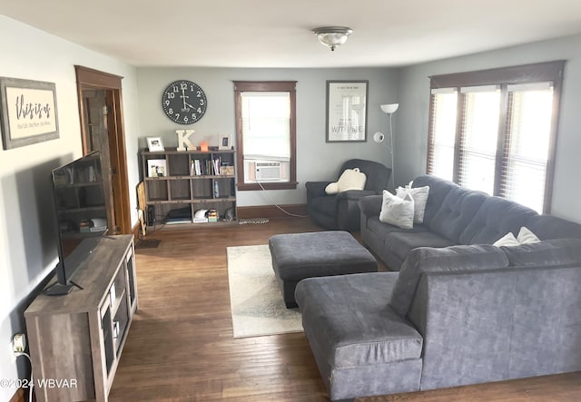 living room with dark hardwood / wood-style flooring and cooling unit