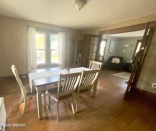 dining area with dark wood-type flooring