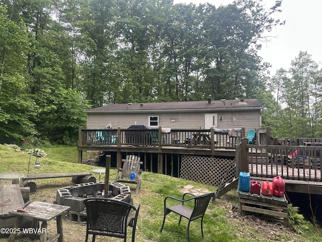207 Bald Eagle Forest Rd, Blanchard, PA 16826 - back of house featuring an outdoor fire pit, a wooden deck, and a lawn