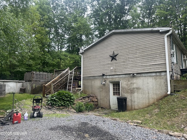 207 Bald Eagle Forest Rd, Blanchard, PA 16826 - view of side of home with a wooden deck, stairway, and view of wooded area