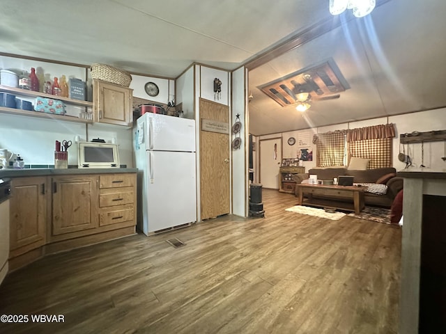 207 Bald Eagle Forest Rd, Blanchard, PA 16826 - kitchen featuring freestanding refrigerator, wood finished floors, dark countertops, and open shelves