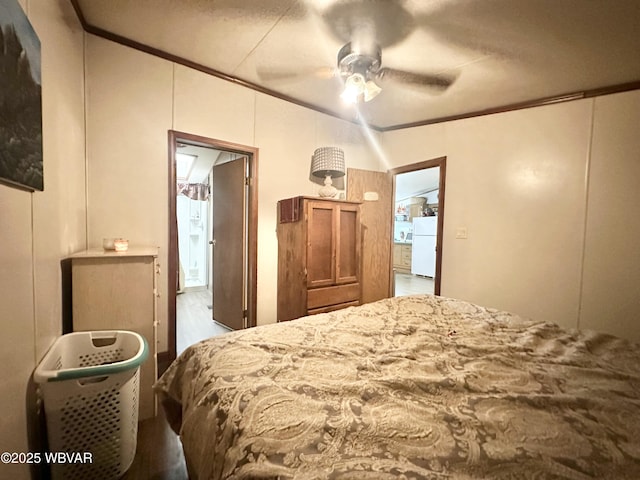 207 Bald Eagle Forest Rd, Blanchard, PA 16826 - bedroom with freestanding refrigerator, ornamental molding, a ceiling fan, and wood finished floors
