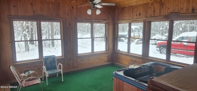 sunroom with a hot tub, ceiling fan, and a healthy amount of sunlight