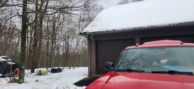 view of snow covered garage