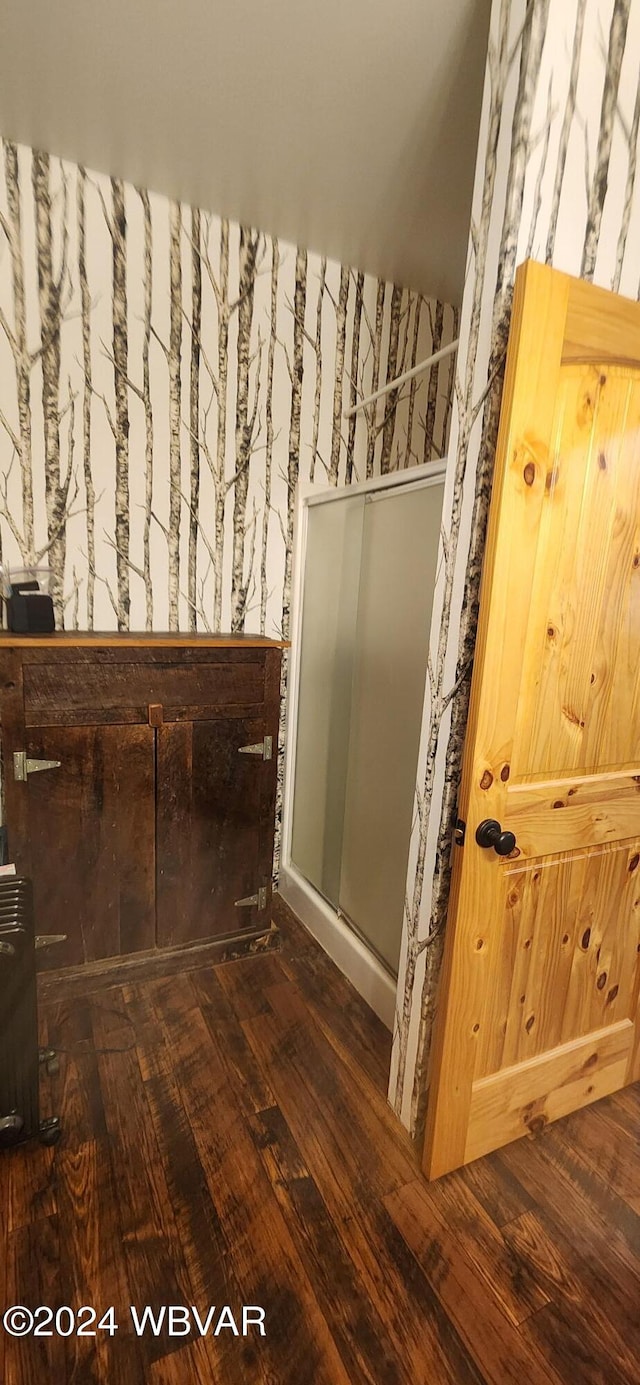 bathroom with hardwood / wood-style floors