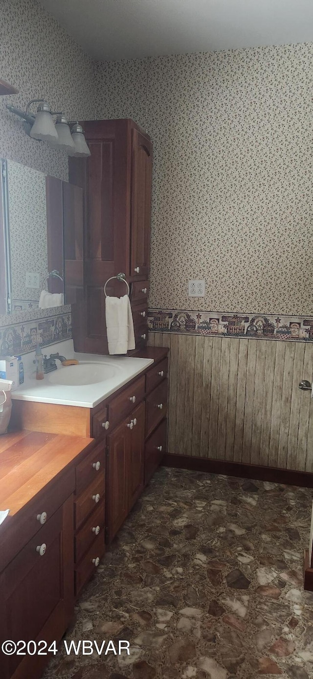 kitchen featuring dark brown cabinets and sink