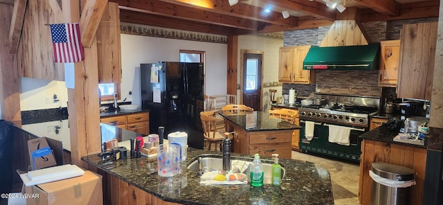 kitchen with dark stone countertops, a kitchen island, black appliances, and extractor fan