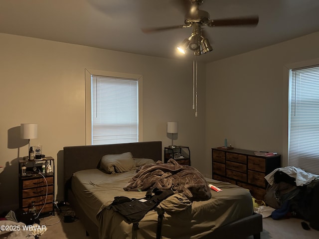 bedroom featuring ceiling fan and carpet floors