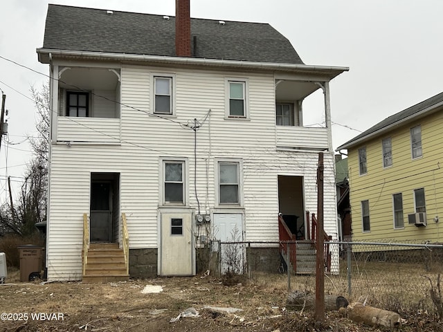 rear view of house featuring cooling unit