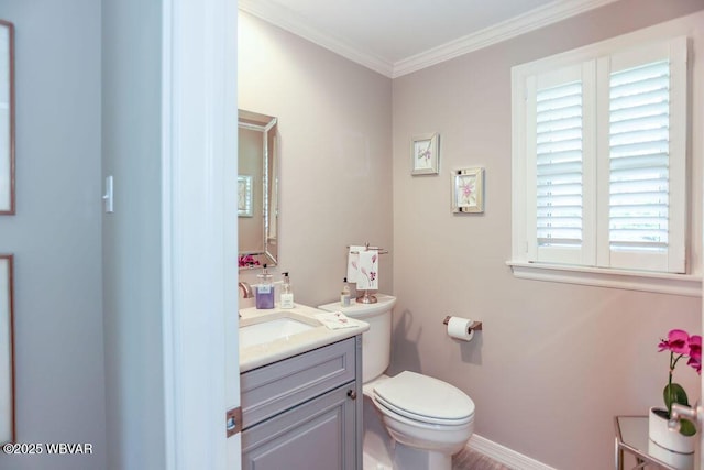 2528 N Hills Dr, Williamsport, PA 17701 - half bathroom with vanity, baseboards, crown molding, and toilet